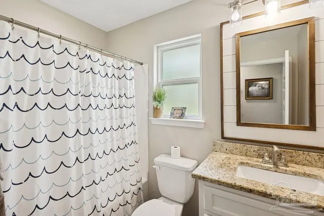 a view of a livingroom with furniture and a window