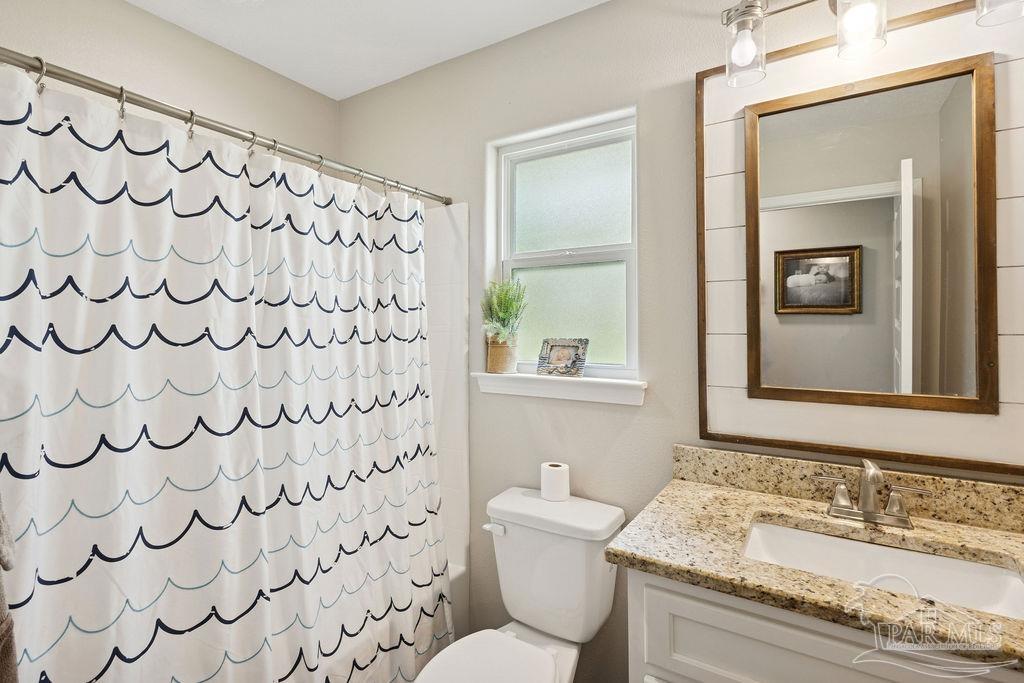1571 Annie Penton Road Jay, FL 32565 - Photo 28 of 46 a bathroom with a granite countertop sink and a mirror