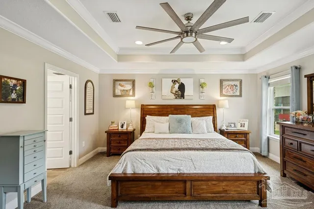 a living room with furniture a chandelier and a flat screen tv