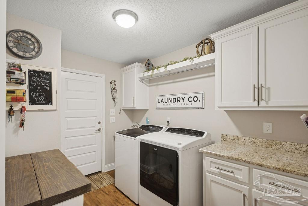 1571 Annie Penton Road Jay, FL 32565 - Photo 36 of 46 a kitchen with stainless steel appliances granite countertop a sink and a stove