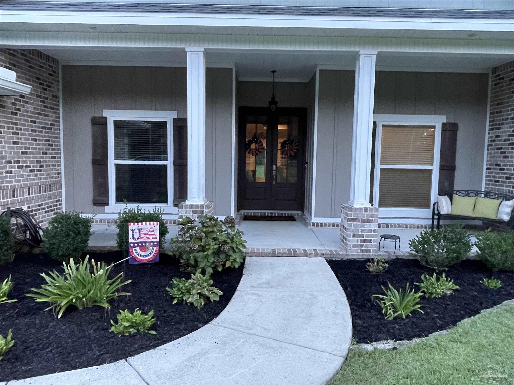 1571 Annie Penton Road Jay, FL 32565 - Photo 40 of 46 a front view of a house with garden