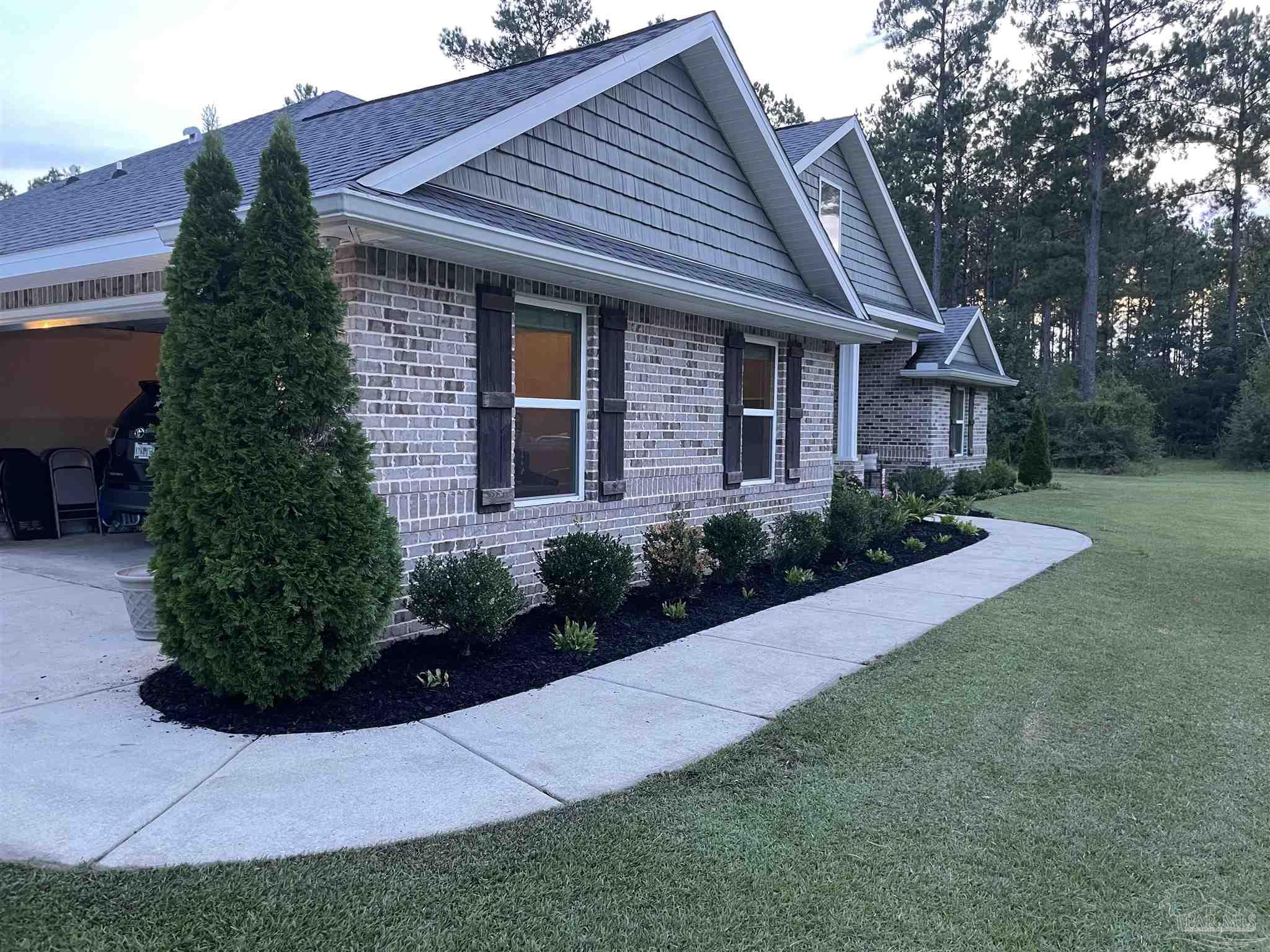 1571 Annie Penton Road Jay, FL 32565 - Photo 44 of 46 a front view of a house with a yard