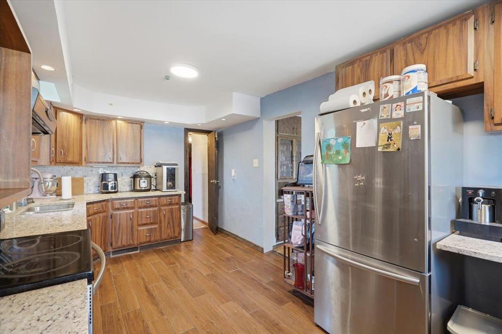 15 Division Street Pittsburgh, PA 15205 - Photo 9 of 44 a kitchen with granite countertop a refrigerator stove and sink