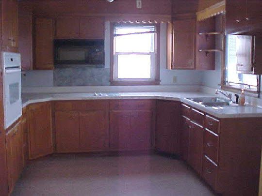 446 North Appleton Road Belvidere, IL 61008 - Photo 2 of 4 a kitchen with a sink cabinets and window
