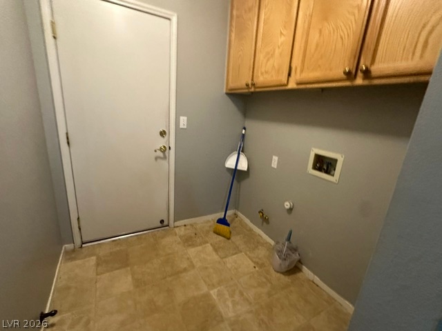 686 Skyline Road Henderson, NV 89002 - Photo 10 of 13 Functional utility space features durable flooring and wood cabinetry with hookups for laundry appliances.