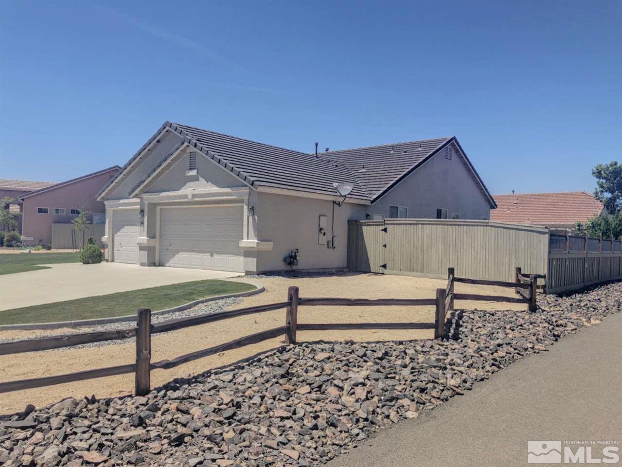 1861 Arboleda Court Reno, NV 89521 - Photo 4 of 15 a front view of a house with a yard