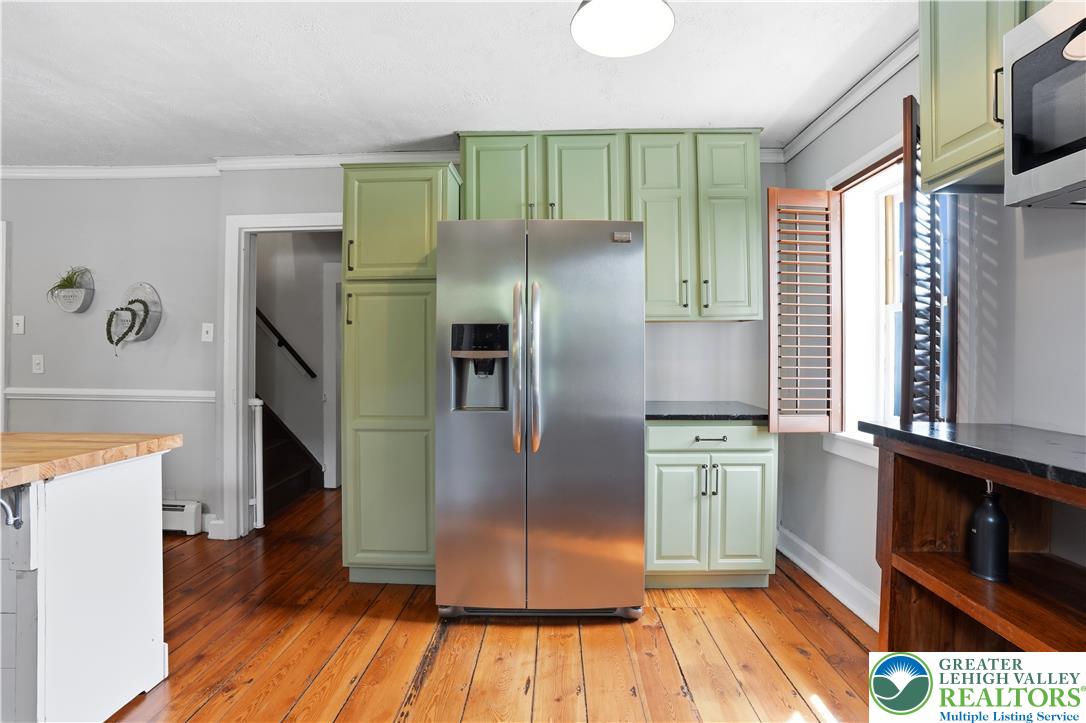 2014 Linden Street Bethlehem, PA 18017 - Photo 20 of 85 A well-equipped kitchen features a stainless steel refrigerator and ample cabinetry, offering both style and utility.