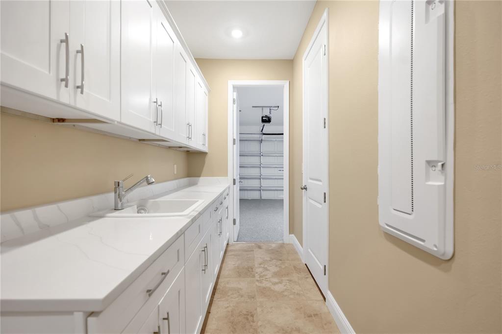 2132 Keystone Pass Boulevard Minneola, FL 34715 - Photo 12 of 52 a bathroom with a sink a vanity and a mirror