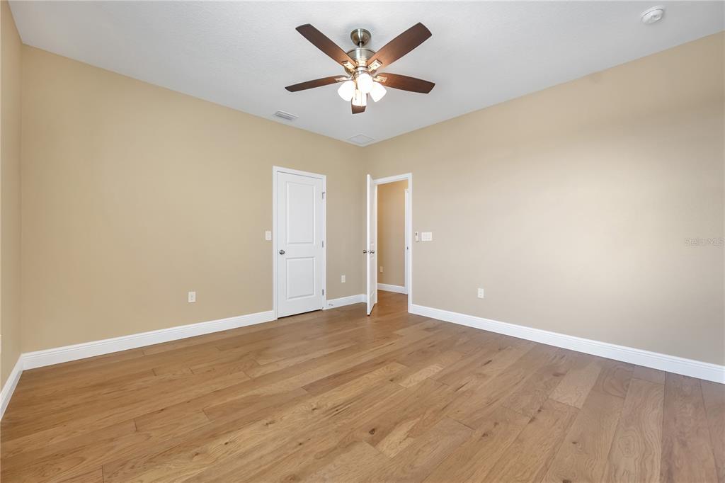 2132 Keystone Pass Boulevard Minneola, FL 34715 - Photo 21 of 52 a view of an empty room with window and a ceiling fan