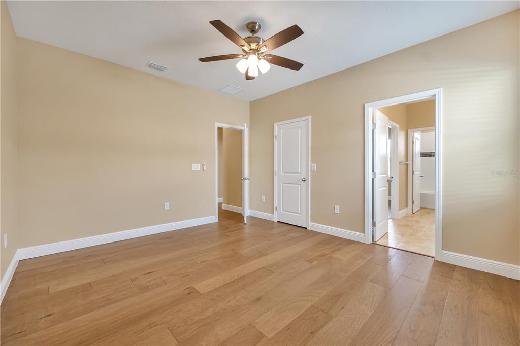 2132 Keystone Pass Boulevard Minneola, FL 34715 - Photo 24 of 52 an empty room with fan and a ceiling fan
