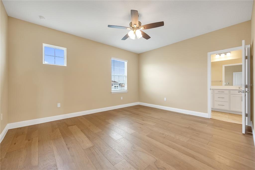 2132 Keystone Pass Boulevard Minneola, FL 34715 - Photo 27 of 52 a view of an empty room with window and wooden floor