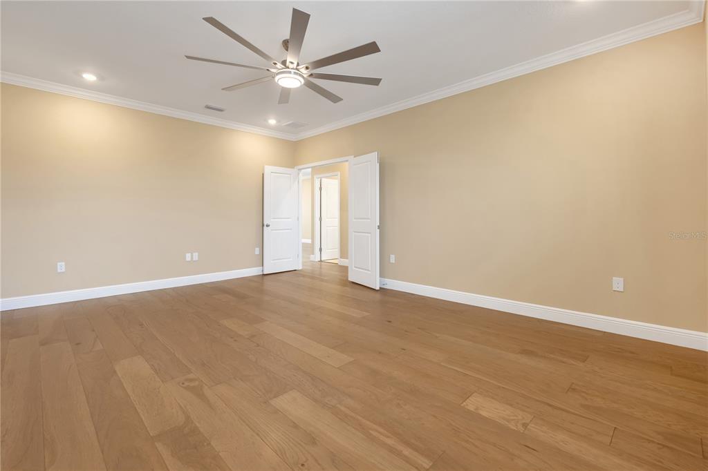 2132 Keystone Pass Boulevard Minneola, FL 34715 - Photo 35 of 52 an empty room with a ceiling fan and window