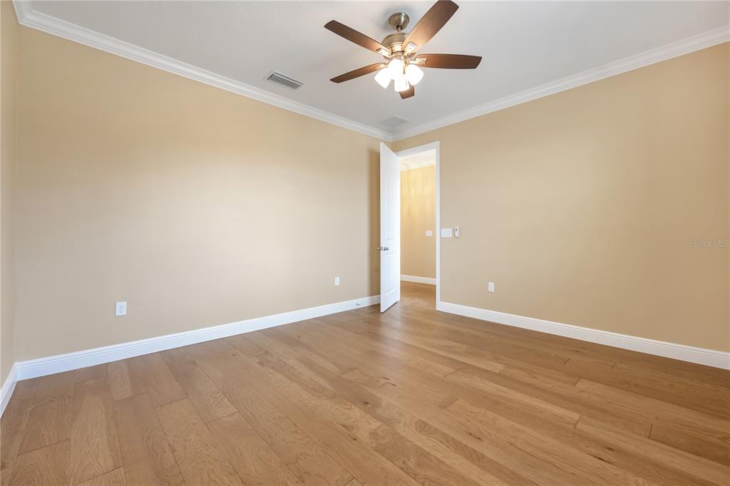 2132 Keystone Pass Boulevard Minneola, FL 34715 - Photo 40 of 52 a view of an empty room with wooden floor