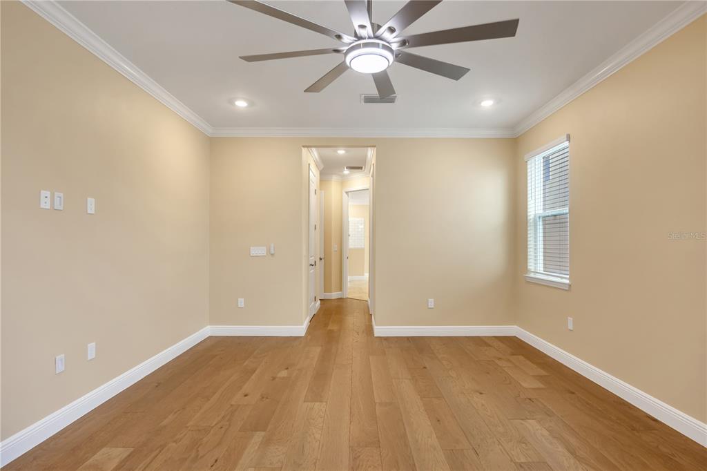 2132 Keystone Pass Boulevard Minneola, FL 34715 - Photo 44 of 52 wooden floor in an empty room with a window