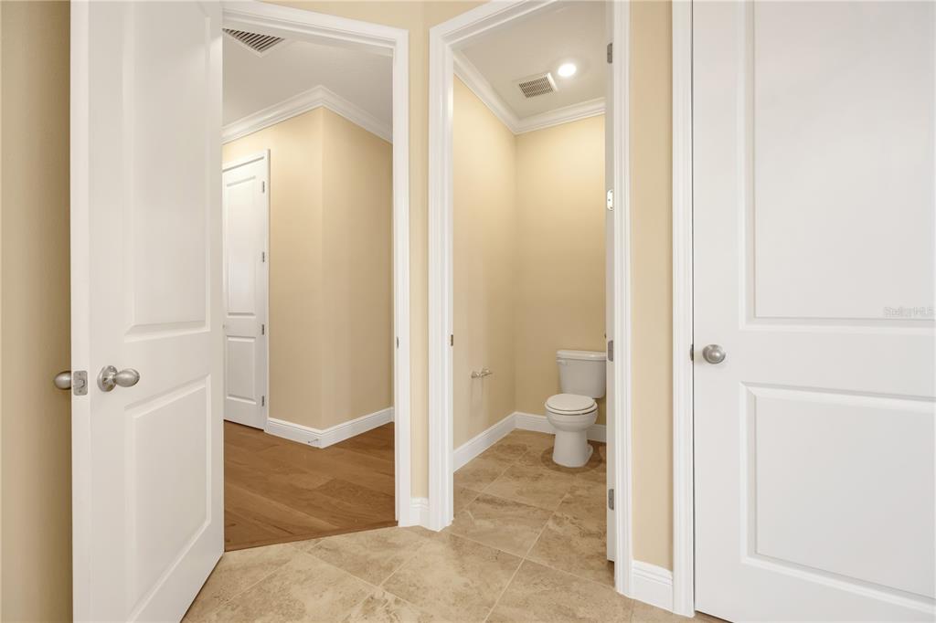 2132 Keystone Pass Boulevard Minneola, FL 34715 - Photo 47 of 52 a bathroom with a granite countertop toilet and a shower
