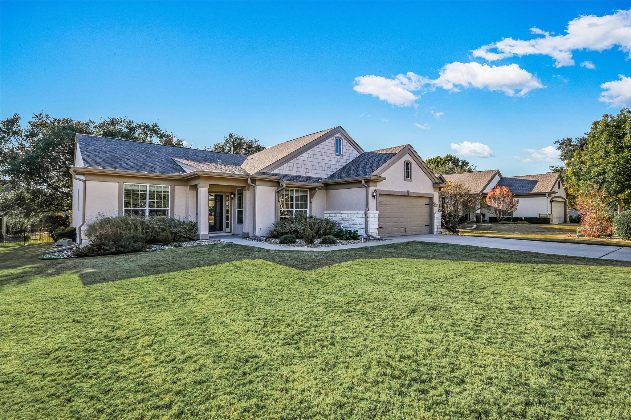 a front view of a house with garden
