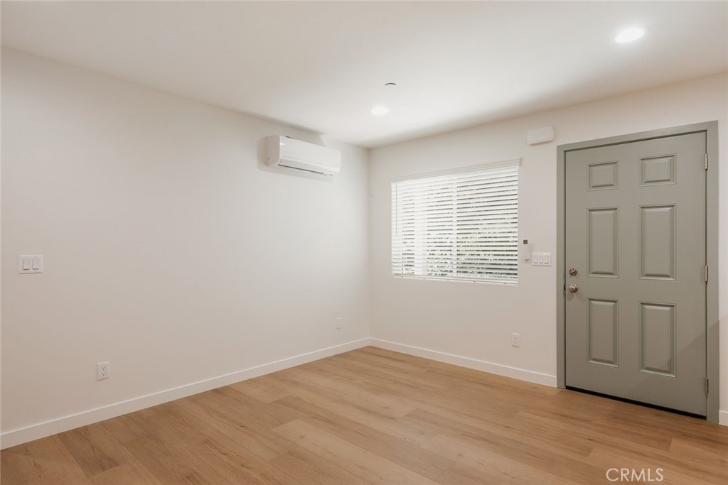 1806 South 8th Street, Unit B Alhambra, CA 91803 - Photo 11 of 44 wooden floor in an empty room with a window
