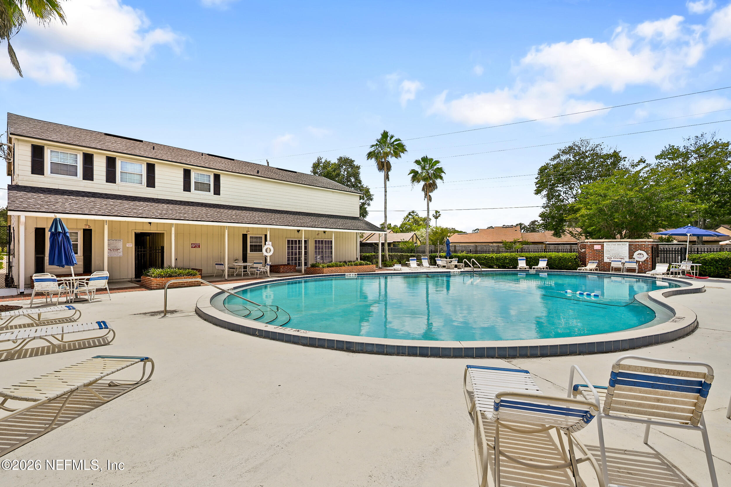 4915 Baymeadows Road, Unit 6G Jacksonville, FL 32217 - Photo 37 of 44 a view of a swimming pool with a patio
