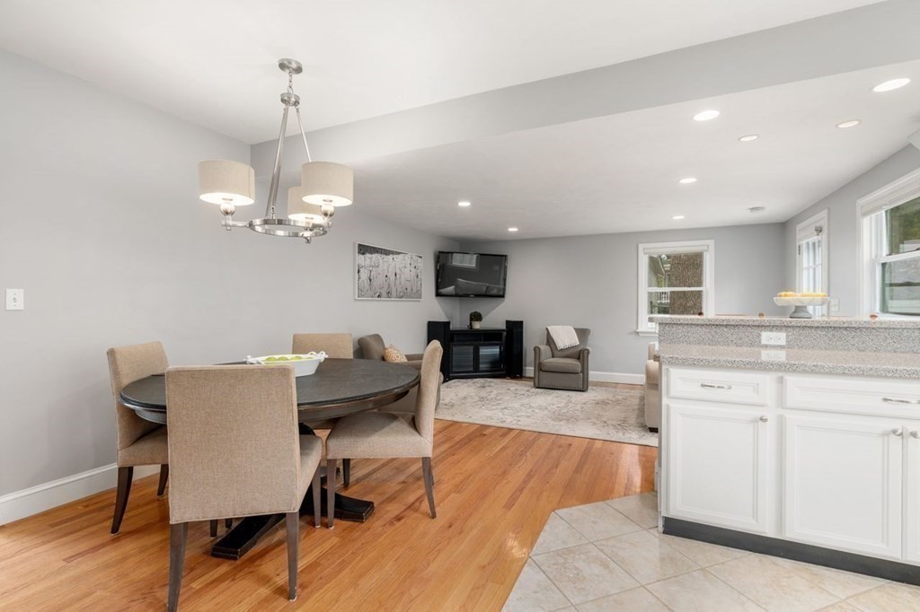 6 Willow Street Natick, MA 01760 - Photo 16 of 32 a view of a dining room with furniture a chandelier and wooden floor