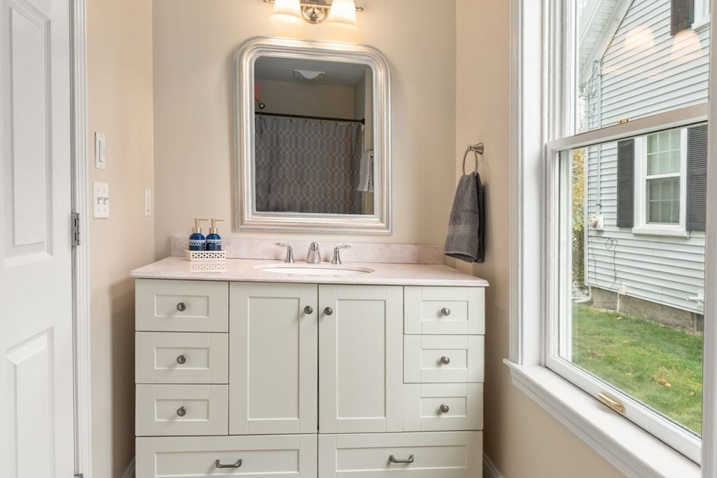 6 Willow Street Natick, MA 01760 - Photo 19 of 32 a bathroom with a sink vanity and mirror