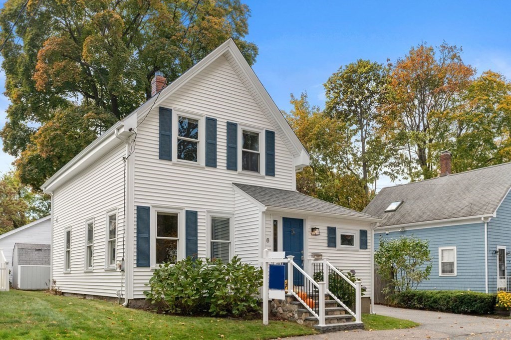 6 Willow Street Natick, MA 01760 - Photo 2 of 32 a front view of a house with garden
