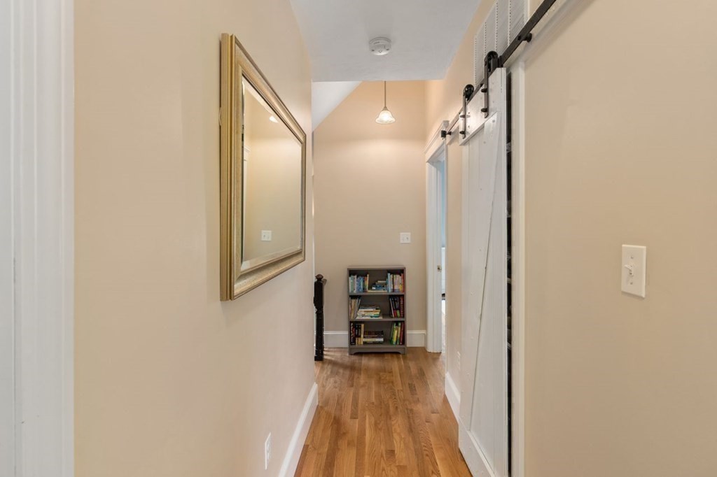 6 Willow Street Natick, MA 01760 - Photo 25 of 32 a view of a hallway view with wooden floor and staircase
