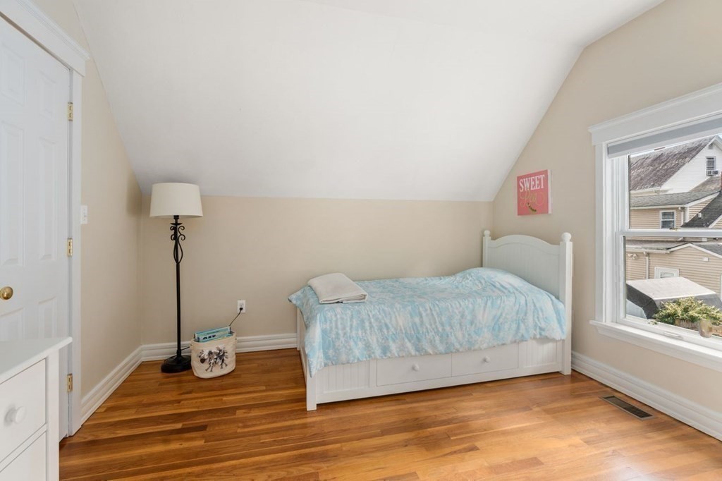 6 Willow Street Natick, MA 01760 - Photo 28 of 32 a bedroom with a bed and a window