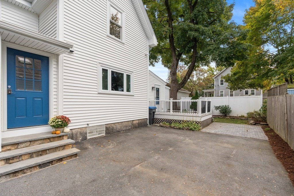 6 Willow Street Natick, MA 01760 - Photo 5 of 32 a white house that has a tree in front of it