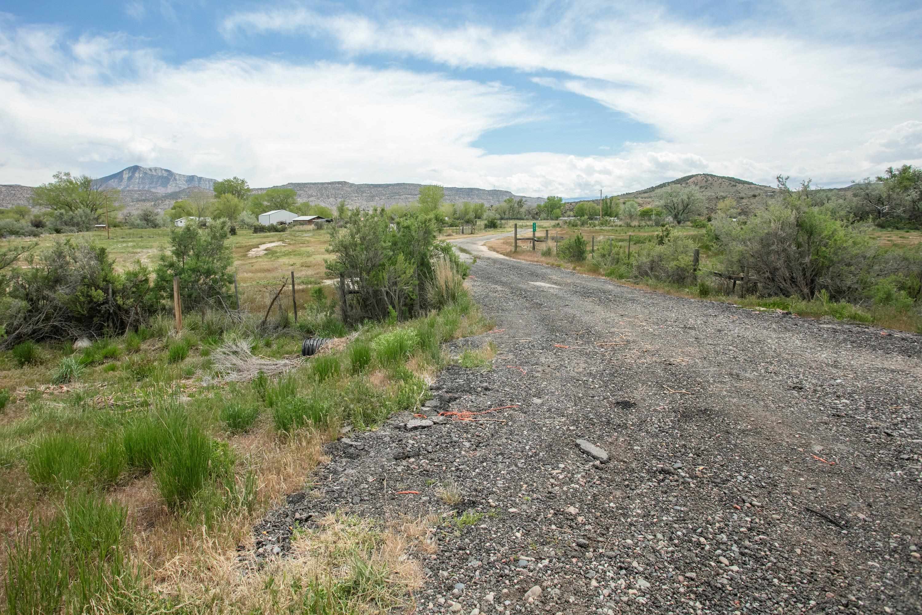 1951 I-70 B Frontage Road De Beque, CO 81630 - Photo 9 of 19 a view of a big yard with lots of green space