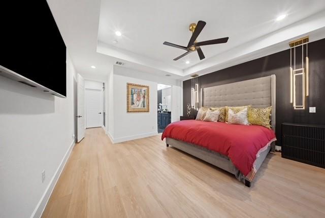 522 South Clark Road Cedar Hill, TX 75104 - Photo 12 of 31 a spacious bedroom with a bed and wooden floor