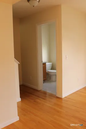 a view of a bathroom with wooden floor