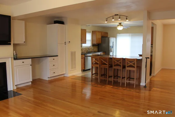 a view of a kitchen and dining room