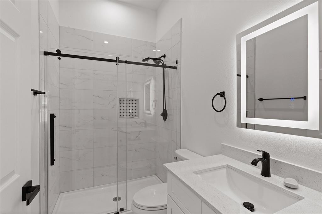 504 South Tennessee Street McKinney, TX 75069 - Photo 21 of 40 Full bath with vanity and a stall shower