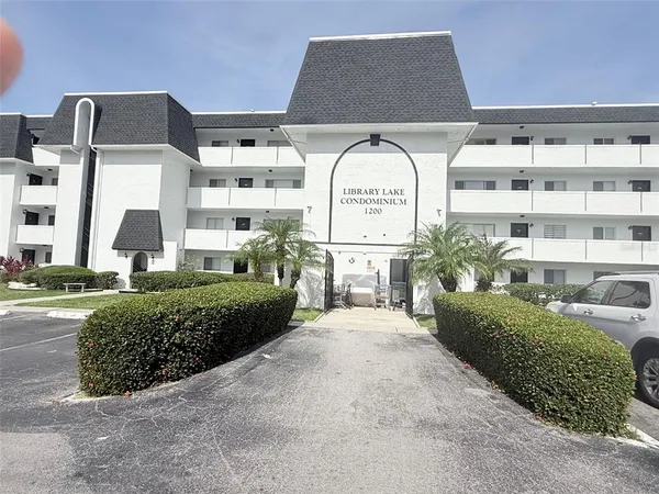a front view of a building with garden