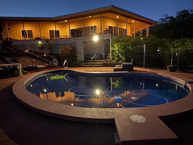 a view of a swimming pool with a patio