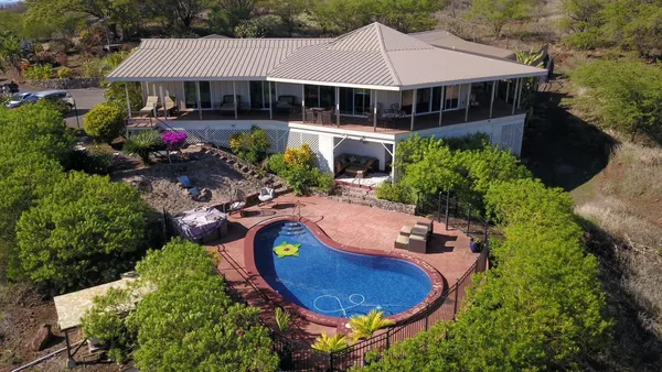 a view of a swimming pool with a patio
