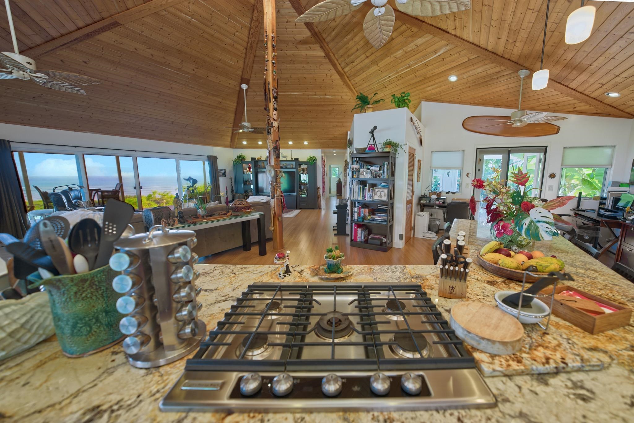 170 Ulua Road Kaunakakai, HI 96748 - Photo 13 of 50 a room with lots of white furniture a rug and a chandelier