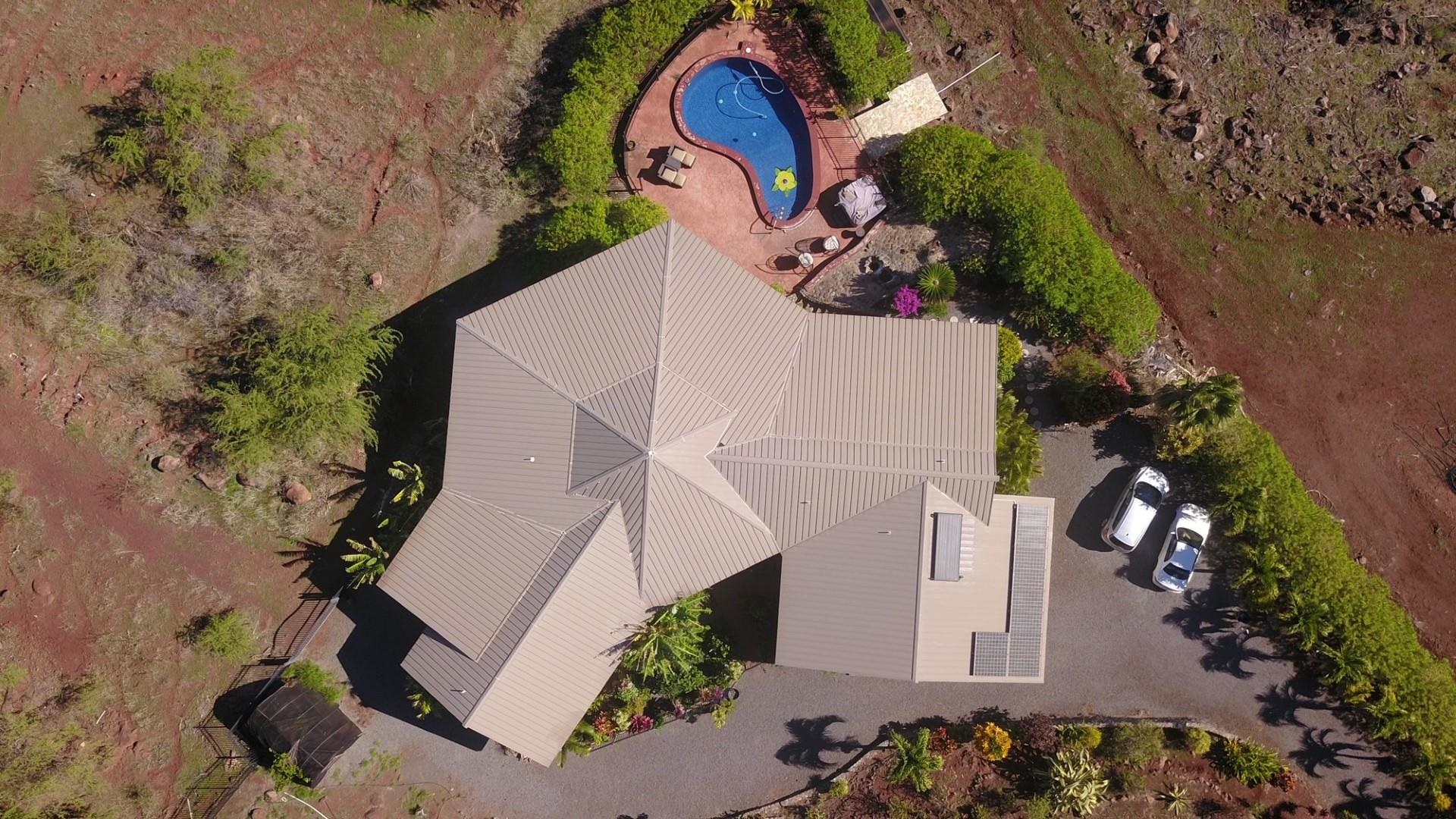170 Ulua Road Kaunakakai, HI 96748 - Photo 3 of 50 an aerial view of a house with a yard and a garage