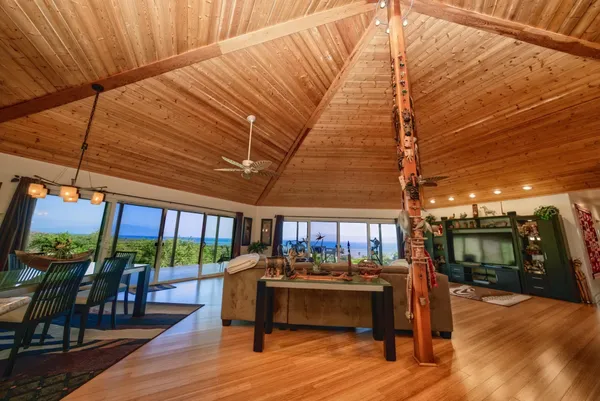 a large kitchen with kitchen island a large island in the center