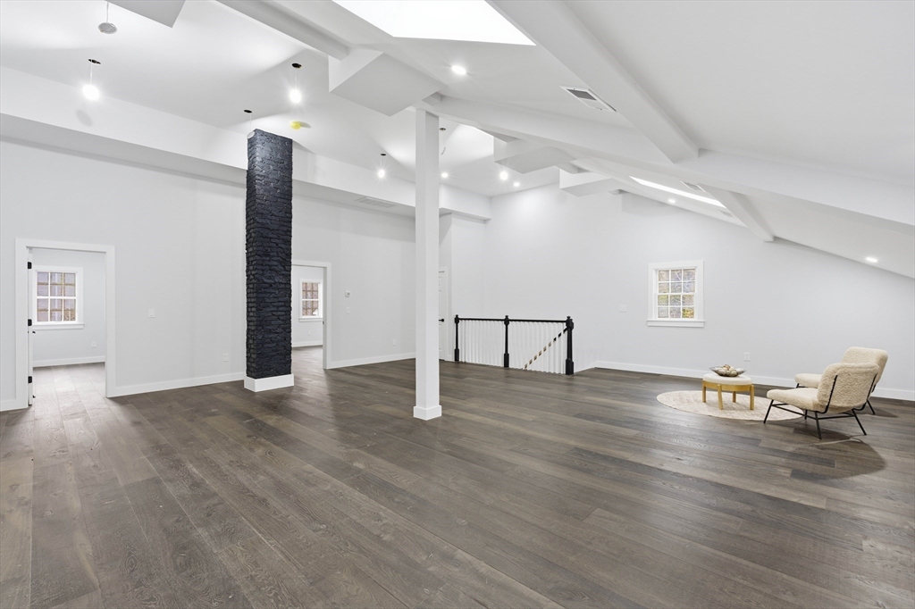 288 Grove Street, Unit 288 Clinton, MA 01510 - Photo 20 of 37 a view of an empty room with wooden floor and a window