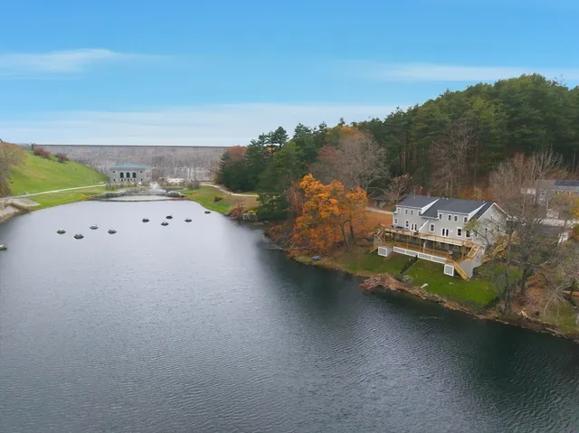 an aerial view of a house with a ocean view