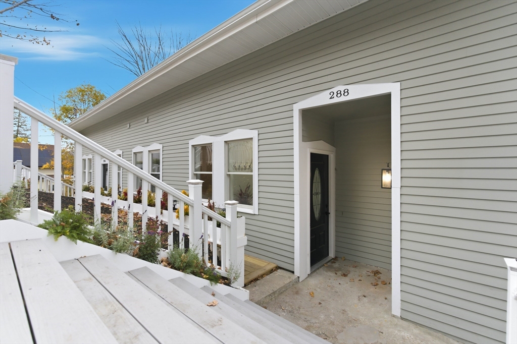 288 Grove Street, Unit 288 Clinton, MA 01510 - Photo 30 of 37 a view of a house with wooden stairs