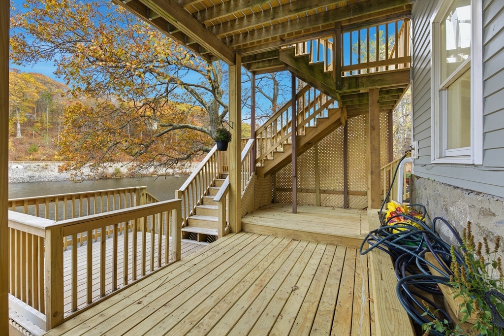 288 Grove Street, Unit 288 Clinton, MA 01510 - Photo 34 of 37 a view of balcony with wooden floor and fence
