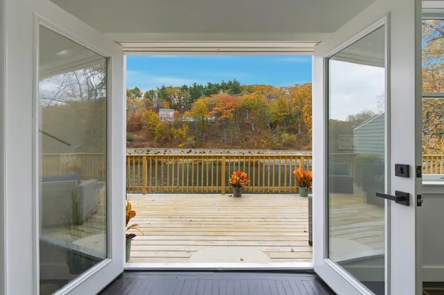a view of a balcony with a glass door