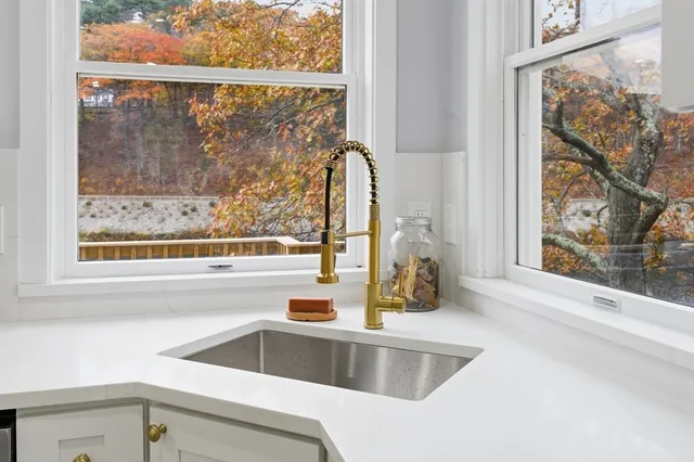 a outdoor living space with patio furniture and a floor to ceiling window