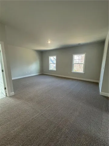 a view of empty room with windows