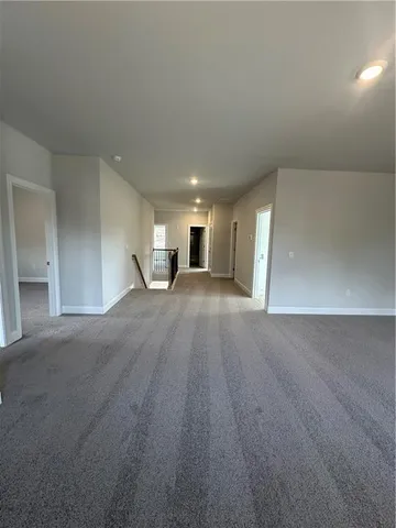 a view of a livingroom with a kitchen