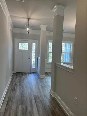 wooden floor in a hall with a window
