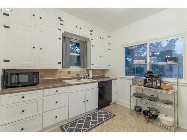 a kitchen with a sink and cabinets