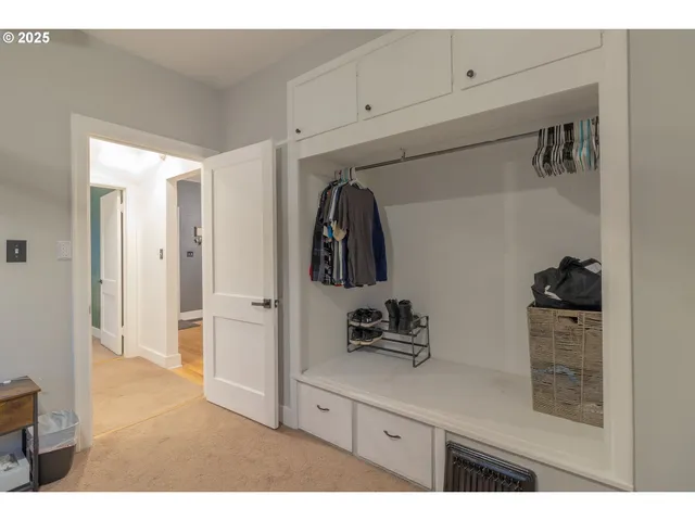 a bedroom with a bed window and a flat screen tv